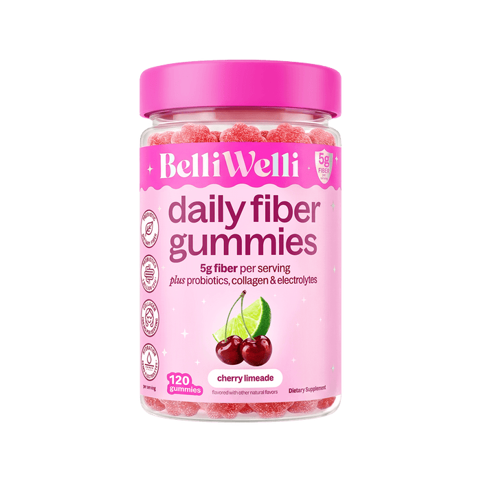 A bottle of BelliWelli Daily Fiber Gummies in cherry limeade flavor, featuring a bright pink cap and a pink label with a cherry and lime graphic, set against a plain white background.